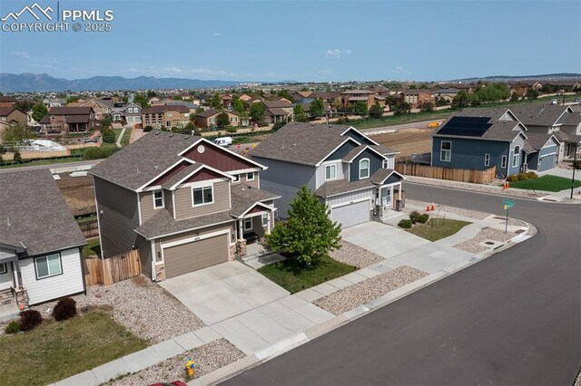 6078 Jorie Rd, Colorado Springs, CO 80927 - view of front of home featuring a residential view, an attached garage, driveway, and a mountain view