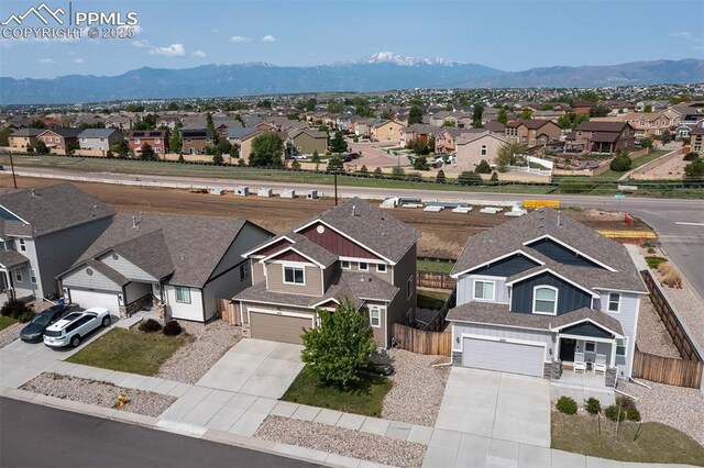 6078 Jorie Rd, Colorado Springs, CO 80927 - aerial perspective of suburban area featuring a mountain backdrop