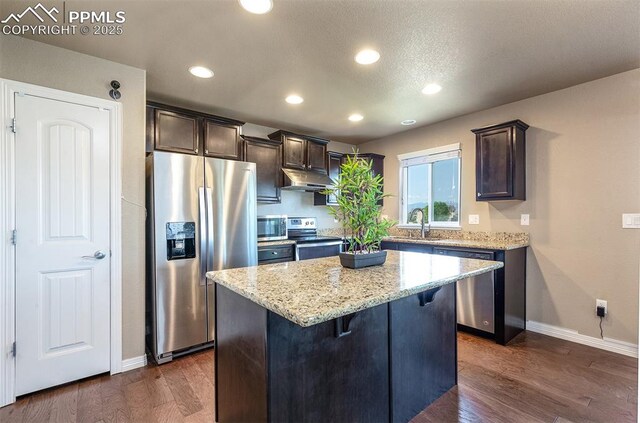 6078 Jorie Rd, Colorado Springs, CO 80927 - kitchen featuring stainless steel appliances, baseboards, dark brown cabinetry, and recessed lighting