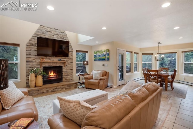 2100 N Elk Rdg, Divide, CO 80814 - living room featuring recessed lighting, a fireplace, light tile patterned flooring, a baseboard radiator, and a baseboard heating unit
