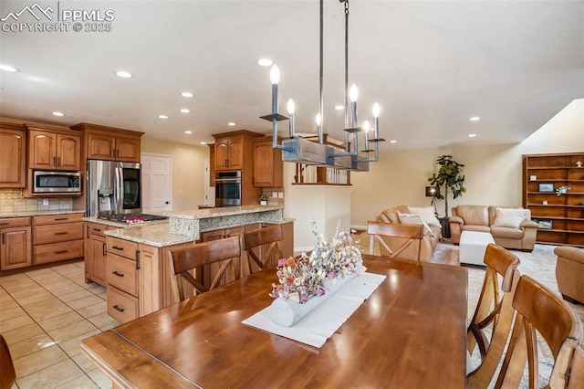 2100 N Elk Rdg, Divide, CO 80814 - dining space with recessed lighting and light tile patterned floors
