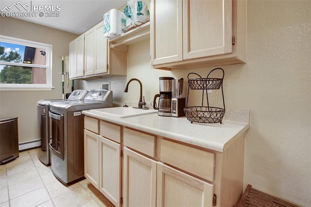 2100 N Elk Rdg, Divide, CO 80814 - laundry room with cabinet space, washer and clothes dryer, a baseboard heating unit, and a textured wall