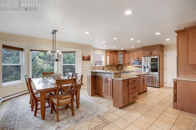 2100 N Elk Rdg, Divide, CO 80814 - kitchen featuring appliances with stainless steel finishes, recessed lighting, tasteful backsplash, plenty of natural light, and light tile patterned flooring