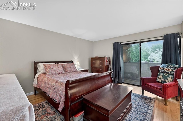 686 Echo Ln, Colorado Springs, CO 80904 - bedroom featuring access to outside and wood finished floors