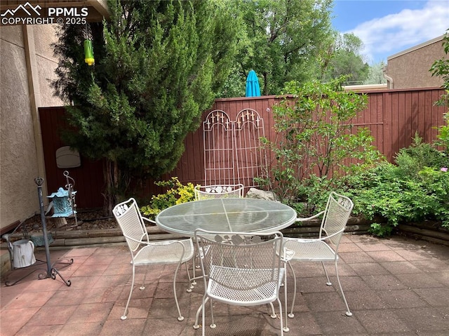 686 Echo Ln, Colorado Springs, CO 80904 - fenced backyard featuring a patio area and outdoor dining space