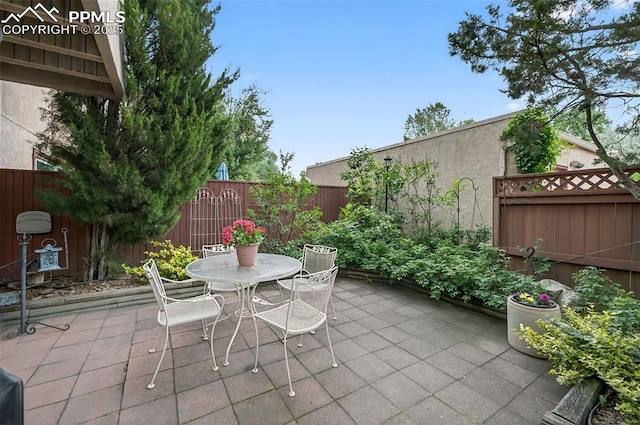 686 Echo Ln, Colorado Springs, CO 80904 - fenced backyard featuring a patio area and outdoor dining area