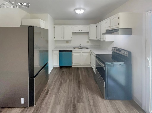 1995 Hampton, Colorado Springs, CO 80906 - kitchen with stainless steel appliances, under cabinet range hood, a sink, and dark wood-type flooring