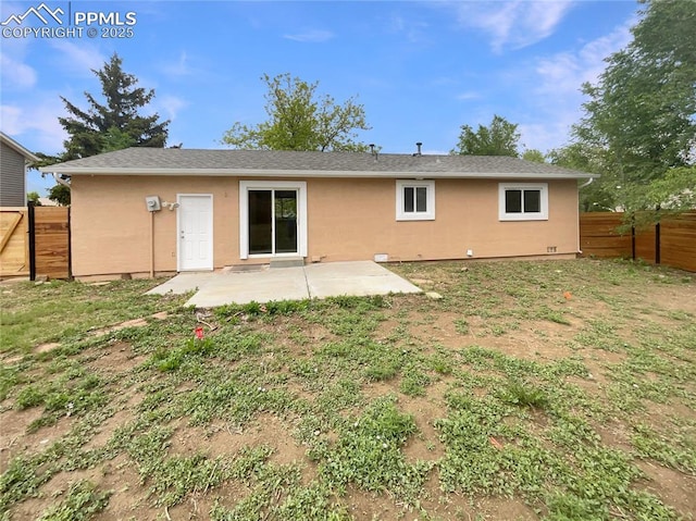 1995 Hampton, Colorado Springs, CO 80906 - rear view of house with stucco siding and a patio area