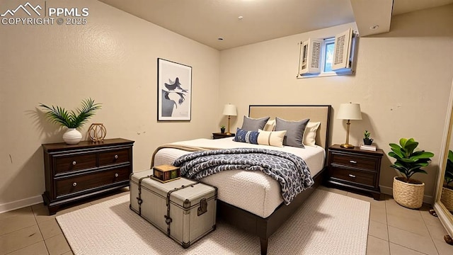 2204 Glenn Summer Rd, Colorado Springs, CO 80909 - bedroom with light tile patterned floors and baseboards