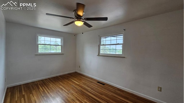 2204 Glenn Summer Rd, Colorado Springs, CO 80909 - unfurnished room featuring healthy amount of natural light, wood-type flooring, and ceiling fan