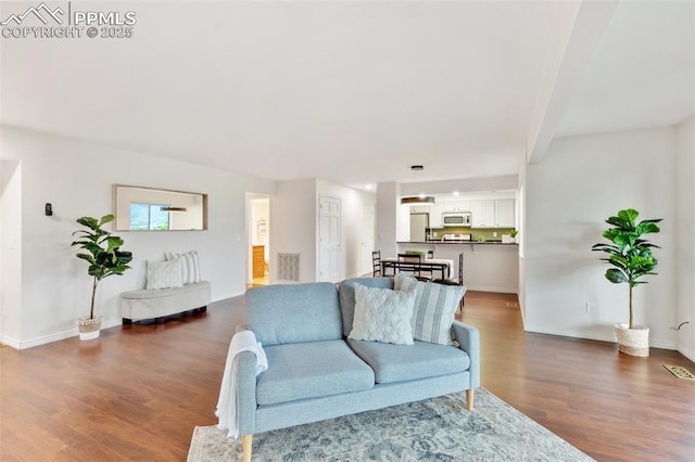 942 Fontmore Rd Unit B, Colorado Springs, CO 80904 - living room featuring wood finished floors and baseboards