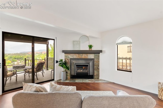 942 Fontmore Rd Unit B, Colorado Springs, CO 80904 - living area with wood finished floors, a tile fireplace, and baseboards