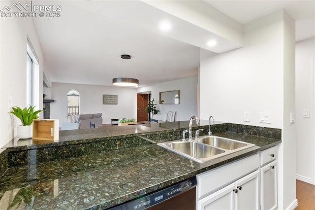 942 Fontmore Rd Unit B, Colorado Springs, CO 80904 - kitchen with a sink, white cabinetry, dishwashing machine, dark stone counters, and hanging light fixtures