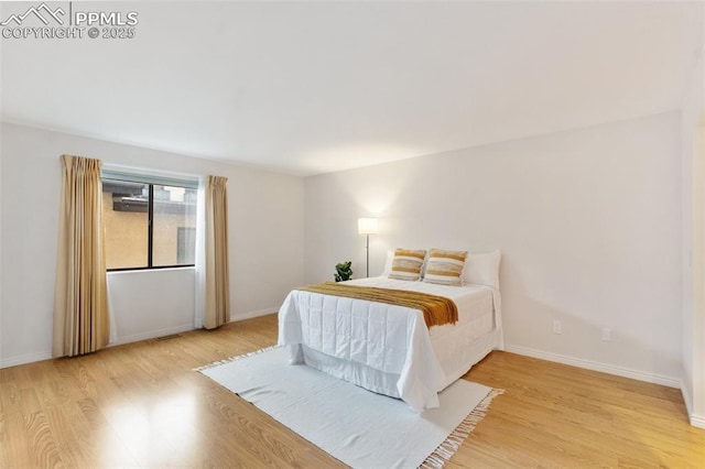 942 Fontmore Rd Unit B, Colorado Springs, CO 80904 - bedroom with light wood-style floors and baseboards