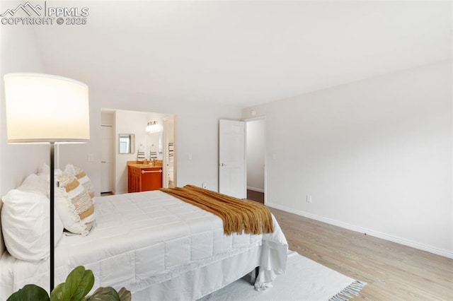 942 Fontmore Rd Unit B, Colorado Springs, CO 80904 - bedroom featuring wood finished floors, baseboards, and ensuite bath
