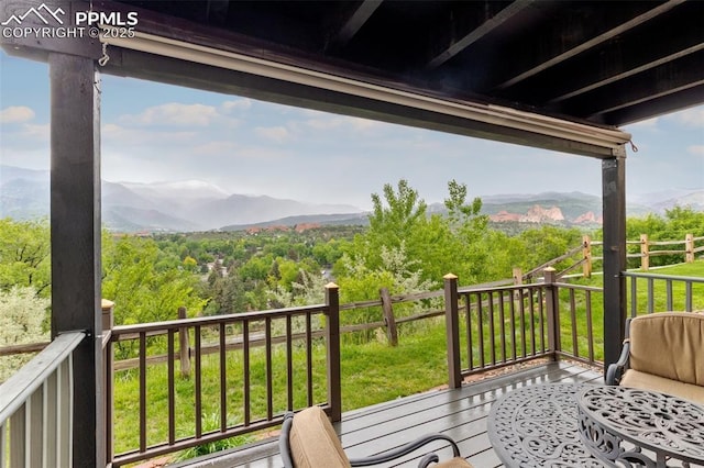 942 Fontmore Rd Unit B, Colorado Springs, CO 80904 - balcony featuring a mountain view and a wooded view