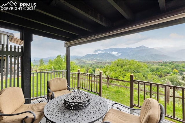 942 Fontmore Rd Unit B, Colorado Springs, CO 80904 - balcony with outdoor dining space, a mountain view, and a wooded view