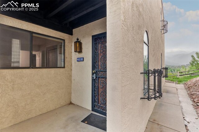 942 Fontmore Rd Unit B, Colorado Springs, CO 80904 - view of exterior entry with stucco siding