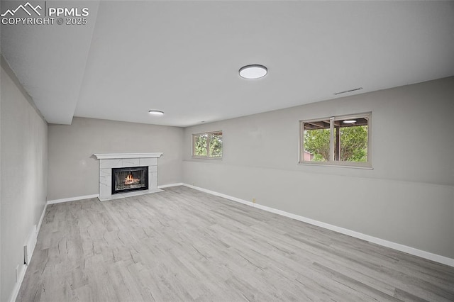 4408 Winding Cir, Colorado Springs, CO 80917 - unfurnished living room with wood finished floors and a fireplace