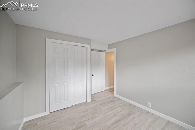 4408 Winding Cir, Colorado Springs, CO 80917 - unfurnished bedroom featuring wood finished floors and a closet