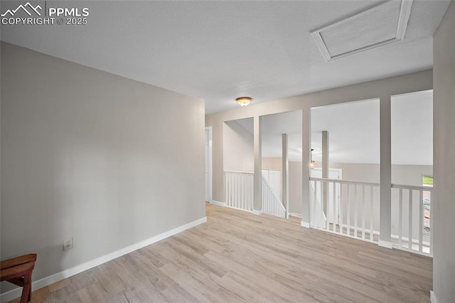 4408 Winding Cir, Colorado Springs, CO 80917 - spare room with wood finished floors and attic access