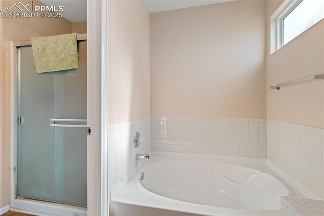 830 Winebrook Way, Fountain, CO 80817 - bathroom with a garden tub and a shower stall