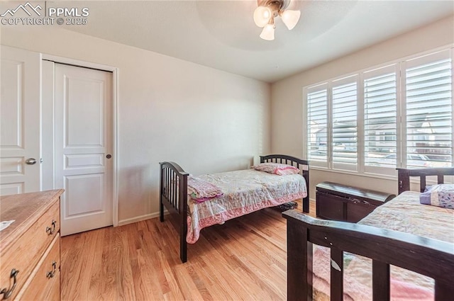 830 Winebrook Way, Fountain, CO 80817 - bedroom with light wood-type flooring, ceiling fan, baseboards, and a closet
