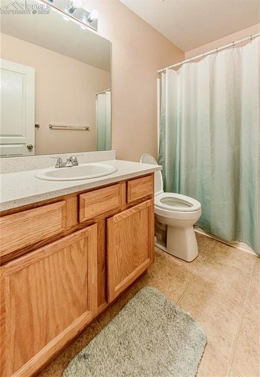 830 Winebrook Way, Fountain, CO 80817 - full bathroom featuring vanity, toilet, and tile patterned flooring