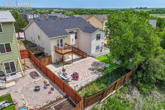 830 Winebrook Way, Fountain, CO 80817 - rear view of house featuring a patio area, a fenced backyard, a wooden deck, roof with shingles, and an outdoor fire pit