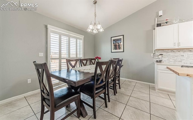 830 Winebrook Way, Fountain, CO 80817 - dining area with lofted ceiling, a chandelier, light tile patterned floors, and baseboards