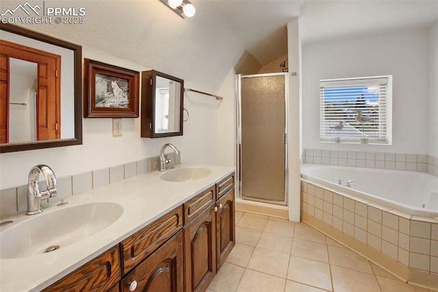 226 W El Paso Ave, Cripple Creek, CO 80813 - full bathroom featuring a shower stall, a bath, double vanity, tile patterned floors, and vaulted ceiling