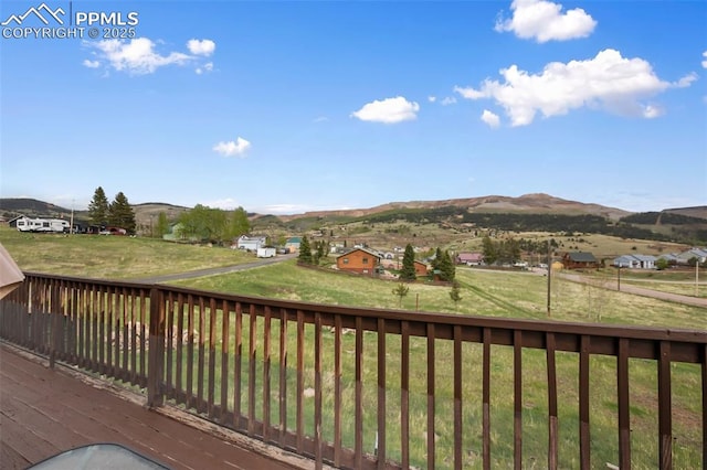 226 W El Paso Ave, Cripple Creek, CO 80813 - wooden deck with a mountain view and a yard
