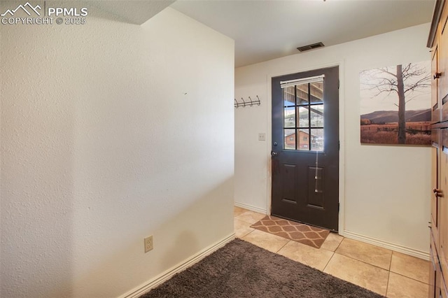 226 W El Paso Ave, Cripple Creek, CO 80813 - foyer with light tile patterned floors and baseboards