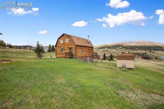 226 W El Paso Ave, Cripple Creek, CO 80813 - view of green lawn with a storage unit and a mountain view