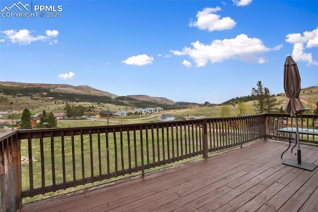 226 W El Paso Ave, Cripple Creek, CO 80813 - wooden deck with a yard and a mountain view