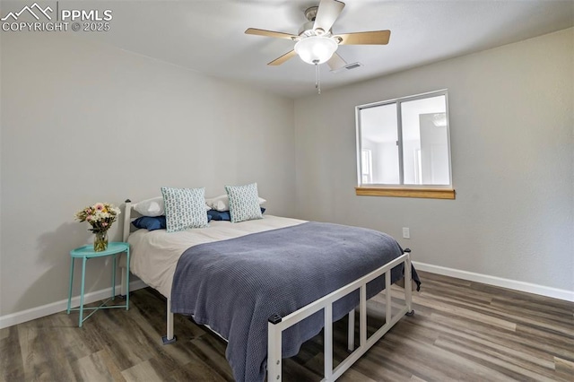 26965 Judge Orr Rd, Calhan, CO 80808 - bedroom featuring baseboards, wood finished floors, and ceiling fan