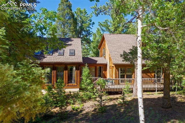 886 Cottonwood Lake Dr, Divide, CO 80814 - view of front of house with a shingled roof and a wooden deck