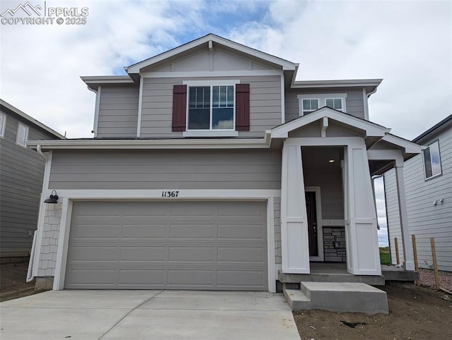 11367 Pikeminnow Pl, Colorado Springs, CO 80925 - view of front of home featuring a garage and concrete driveway