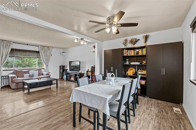 4303 W Eastcrest Cir, Colorado Springs, CO 80916 - dining space featuring a ceiling fan and light wood finished floors