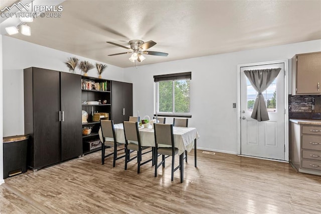4303 W Eastcrest Cir, Colorado Springs, CO 80916 - dining room featuring a ceiling fan and light wood-type flooring