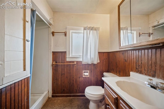 117 S Limit St, Colorado Springs, CO 80905 - full bath featuring wainscoting, vanity, toilet, wooden walls, and a shower