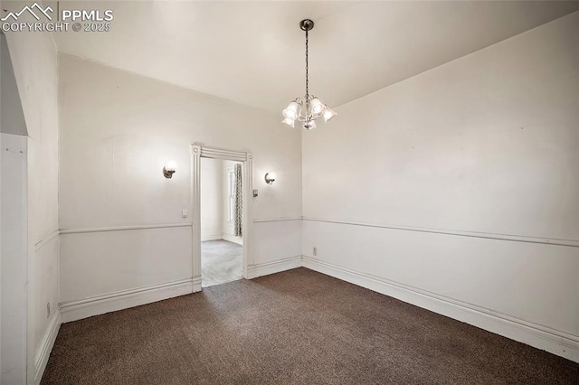 117 S Limit St, Colorado Springs, CO 80905 - spare room with dark carpet, a chandelier, and baseboards