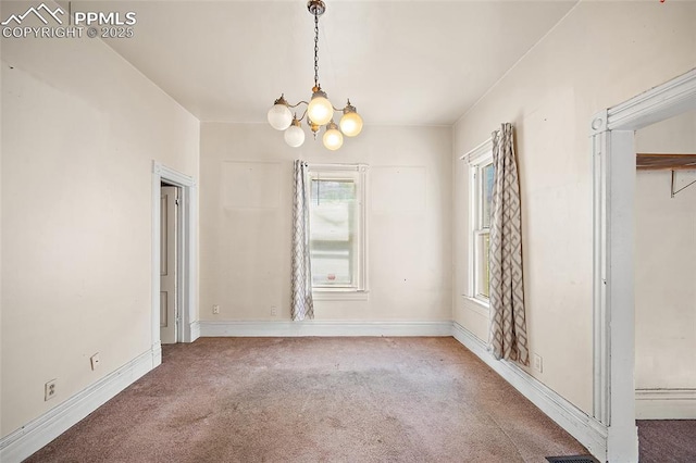 117 S Limit St, Colorado Springs, CO 80905 - unfurnished dining area with carpet floors, a chandelier, and baseboards