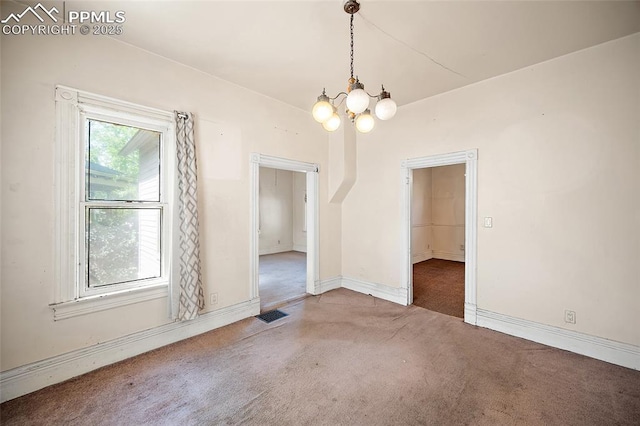 117 S Limit St, Colorado Springs, CO 80905 - empty room with carpet flooring, a chandelier, and baseboards