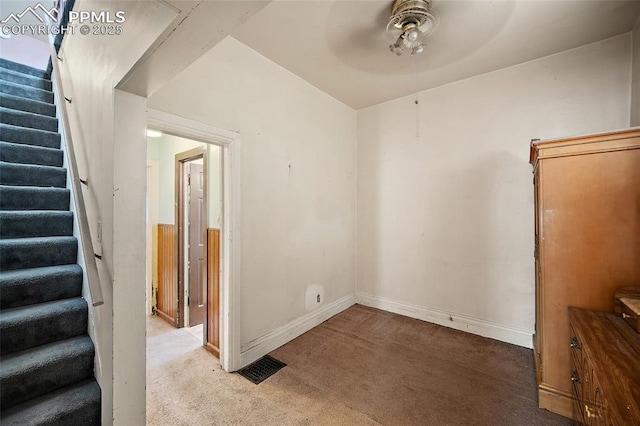 117 S Limit St, Colorado Springs, CO 80905 - carpeted empty room with stairs, ceiling fan, and baseboards
