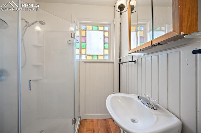 117 S Limit St, Colorado Springs, CO 80905 - full bath featuring a stall shower, a sink, and wood finished floors