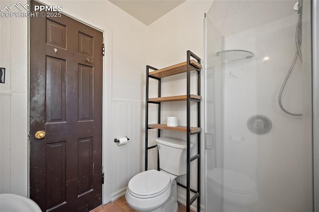 117 S Limit St, Colorado Springs, CO 80905 - bathroom featuring toilet, a shower stall, wainscoting, and wood finished floors