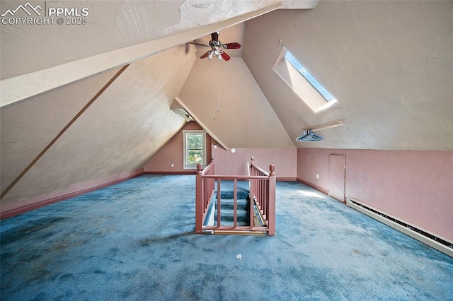 117 S Limit St, Colorado Springs, CO 80905 - additional living space with a skylight, vaulted ceiling, a ceiling fan, carpet, and a baseboard radiator