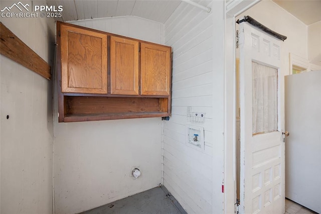 117 S Limit St, Colorado Springs, CO 80905 - laundry area with cabinet space, hookup for a washing machine, and wooden walls