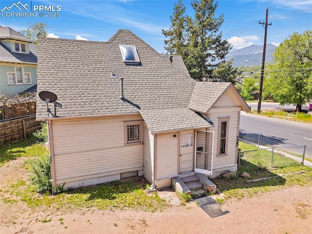 117 S Limit St, Colorado Springs, CO 80905 - view of front of property with a shingled roof, entry steps, and a mountain view